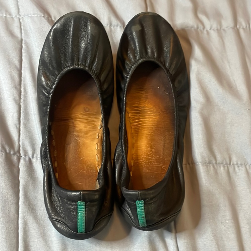 Well traveled black Tieks size 10